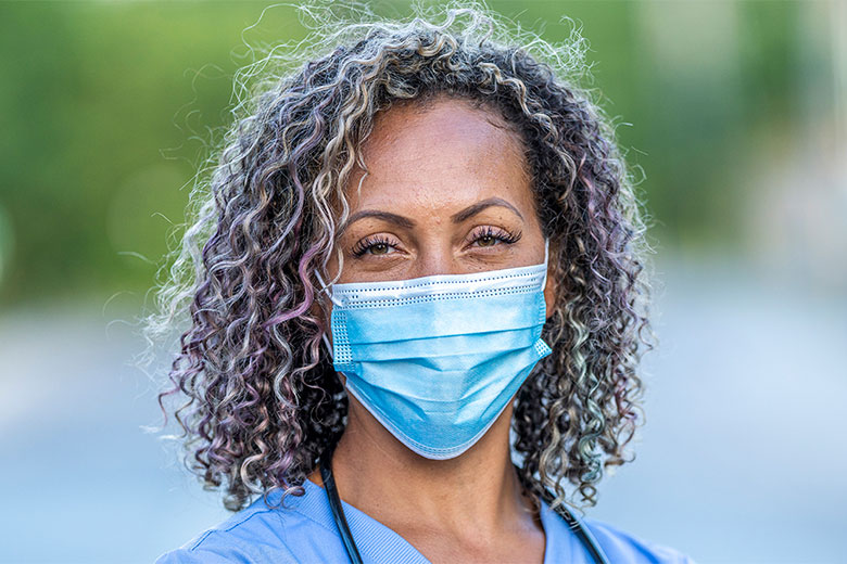 Woman clinician wearing a mask